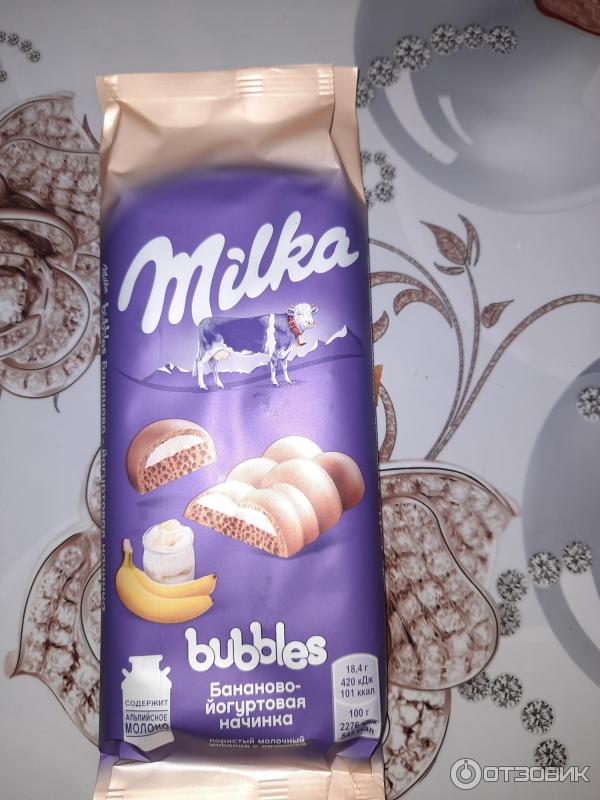 Шоколад молочный пористый Milka Bubbles с бананово-йогуртовой начинкой фото