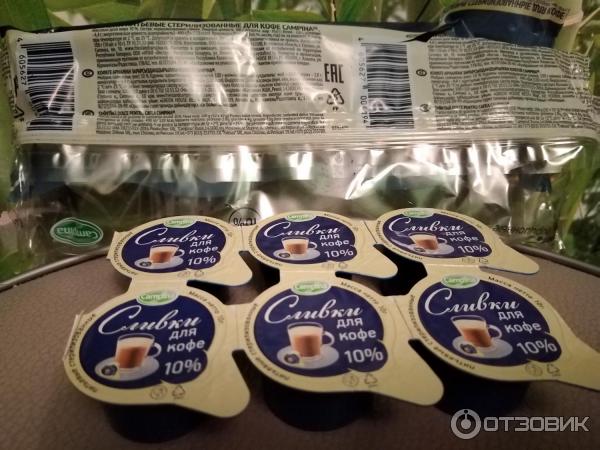 Сливки порционные Campina 10% фото